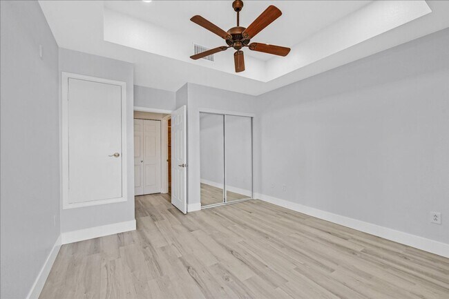 Building Photo - Top level 2 bedroom condo located in guard...