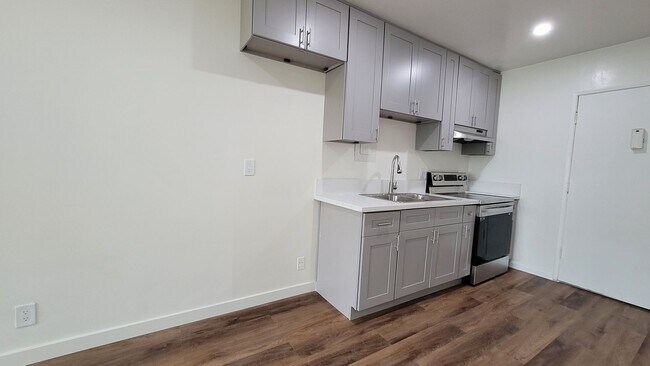Building Photo - 1 Month Free! Fully Renovated Studio with ...