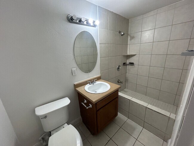 Building Photo - Single story home with large backyard and huge carport with plenty of storage.
