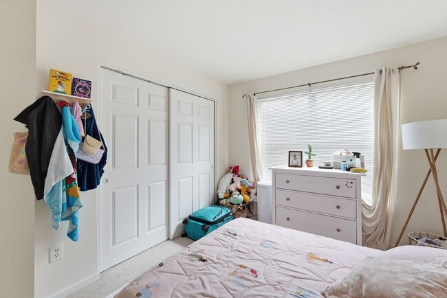 Building Photo - Bathed in natural light, this stunning second level condominium offers an effortless blend of com...