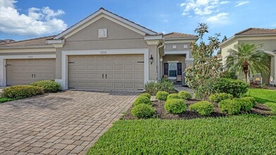 Building Photo - 2/2 plus den/office Villa in with a 2 car garage
