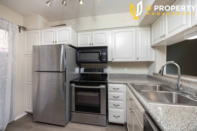 Building Photo - Updated Condo with New Vinyl Flooring & Ne...