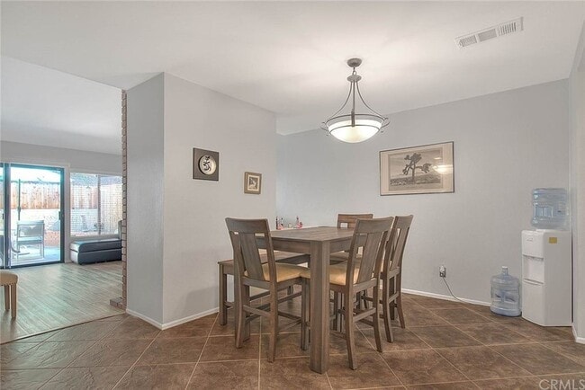 Dining room and living room and attached private yard - 1073 S Romney Dr