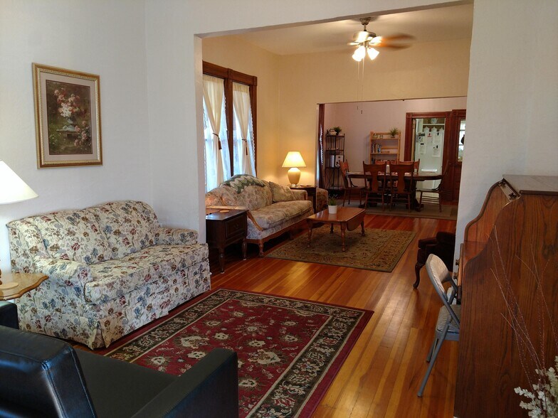 View of living spaces from front door entrance (furnishings not included with rental) - 607 Harrison Ave