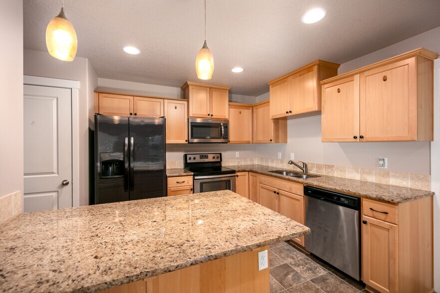 kitchen with pantry door - 1295 Windsong Dr