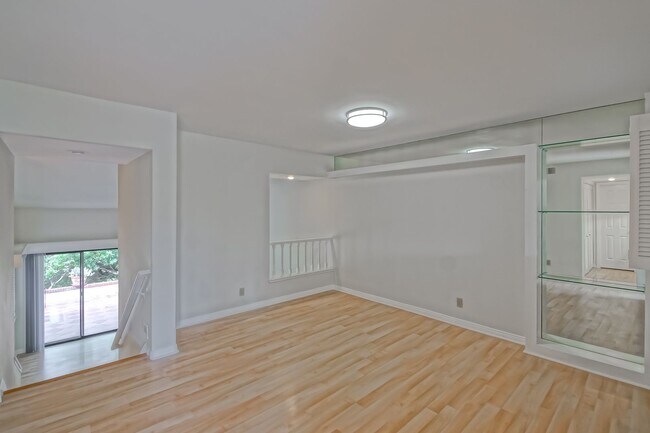 Building Photo - PRIME POOLFRONT LOCATION & CLOSE TO MAIN GATE! BRIGHT & SPACIOUS, END-UNIT POOLFRONT TOWNHOUSE W/...