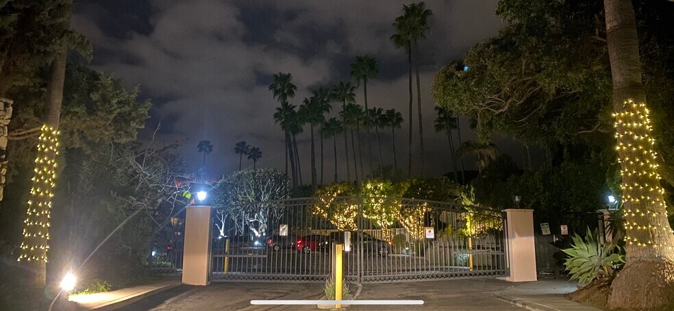 Gated entrance to Brentwood Sunset at night - 241 S Barrington Ave