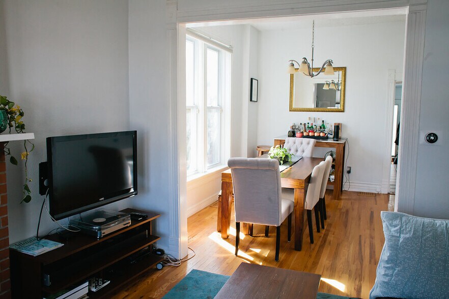Living room flowing into Dining room - 2432 W 37th Avenue