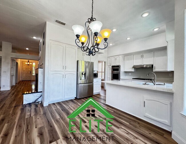 Building Photo - **Stunning Custom Home with Solar and Pool...