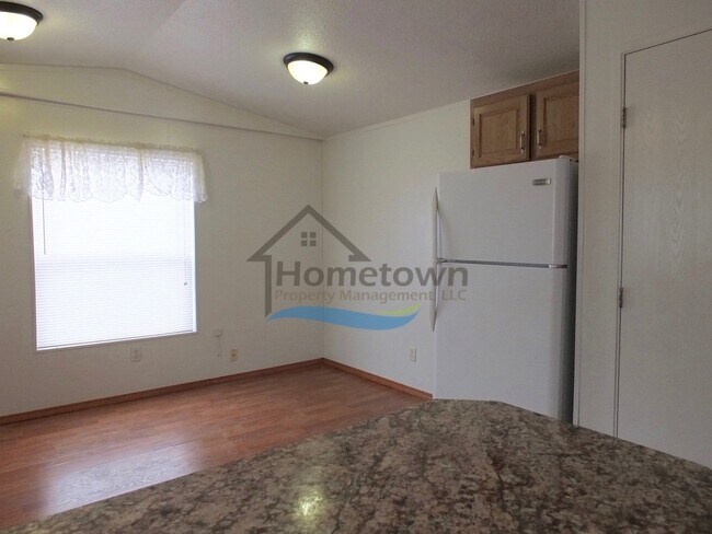 Building Photo - 2 Bed 1 Bath Mobile with Fenced Yard and Storage Shed!