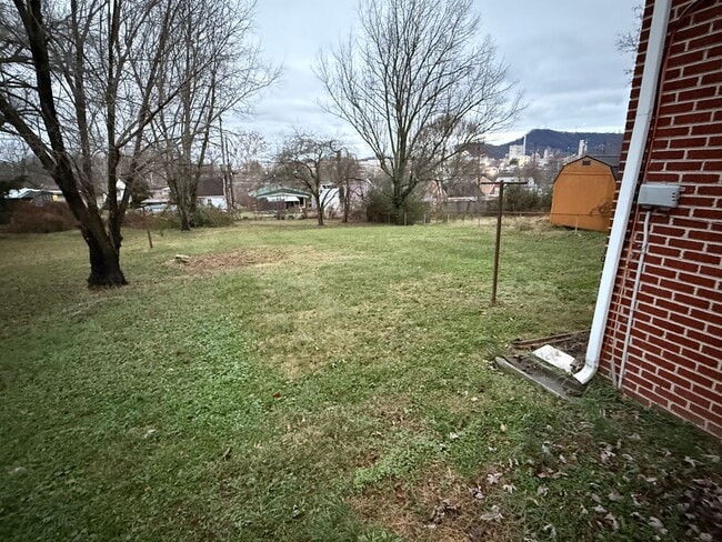 Building Photo - Updated 4BR Home with Finished Basement & Level Yard