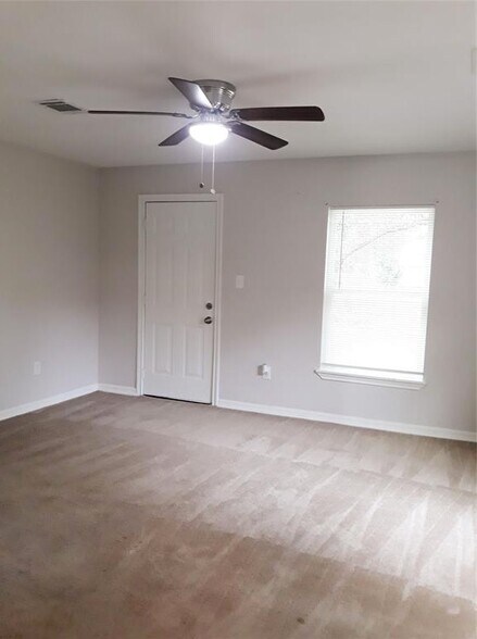 Bedroom now with new flooring - 7324 N Martin Luther King Ave
