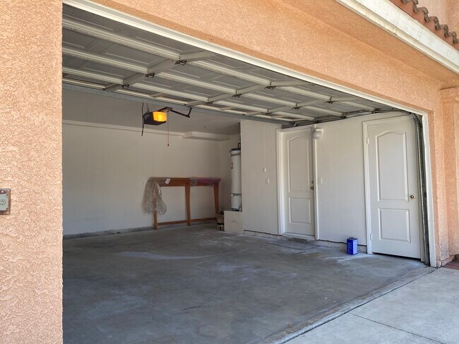 2-Car Garage with entrances to storage room and kitchen - 915 W Arrow Hwy