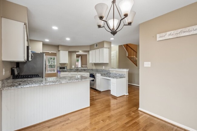 Building Photo - Modern Brick End-Unit Townhome with Stunning Upgrades and Serene Wooded Views