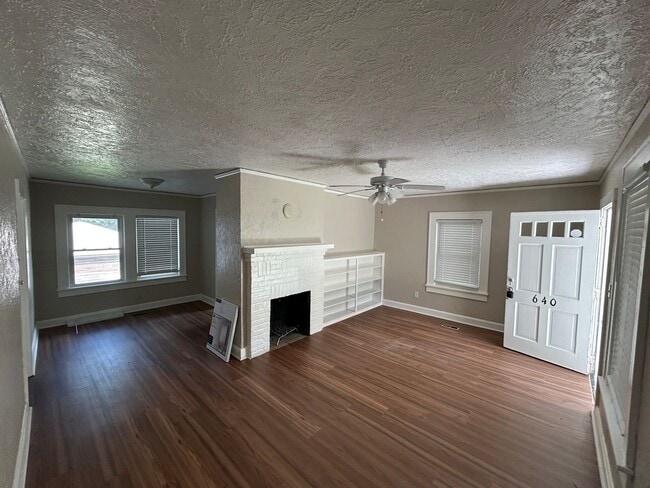 Building Photo - Freshly Painted 2x1 with Brand-New Plank Floors