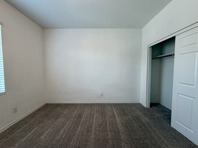 Building Photo - GATED 3 BED 2.5 BATH TOWNHOME WITH 2-CAR GARAGE, COVERED PATIO & COMMUNITY POOL