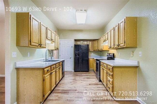 Building Photo - 10693 W 63rd Dr