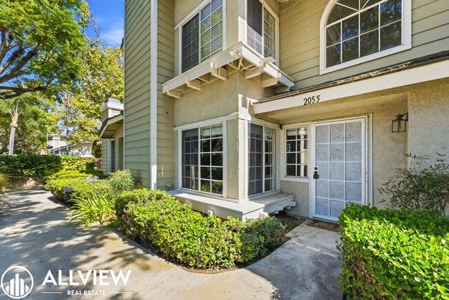 Building Photo - Fully Renovated 2 Bed Townhome with Private Patio, 2-Car Garage & Community Pool