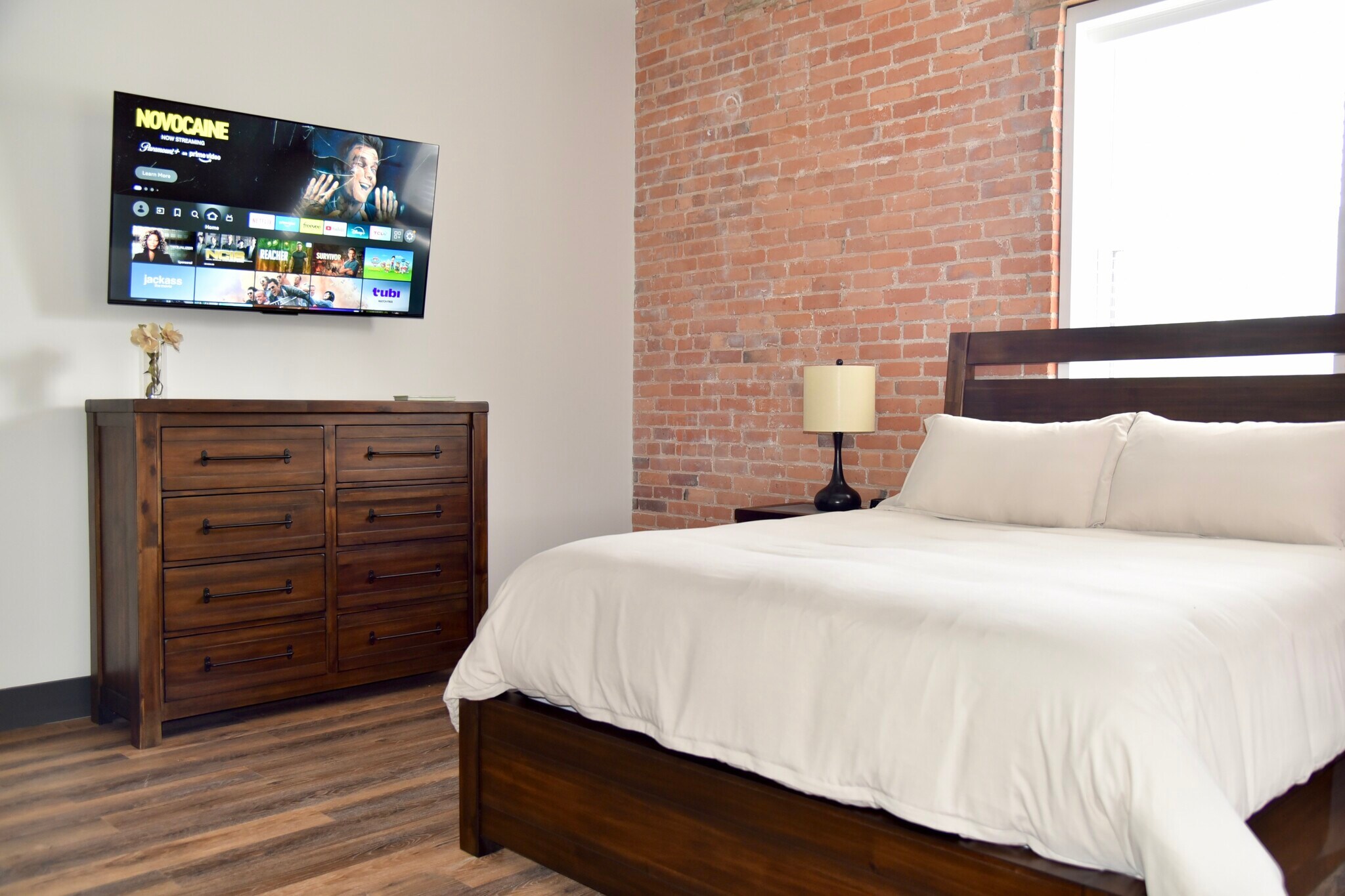 A Smart TV is provided in each room. Simply login to your streaming services. - 101 W Broadway St