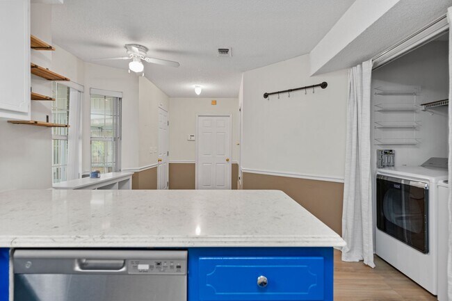 Building Photo - Spacious 3BR Retreat with Soaring Ceilings & Screened Porch