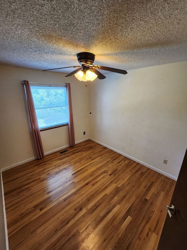 Building Photo - Spacious 4-Bedroom Home with RV Parking in...
