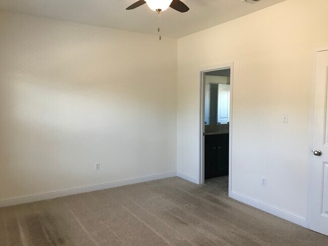 Front upstairs bedroom with walk in closet - 3776 River Trace Dr