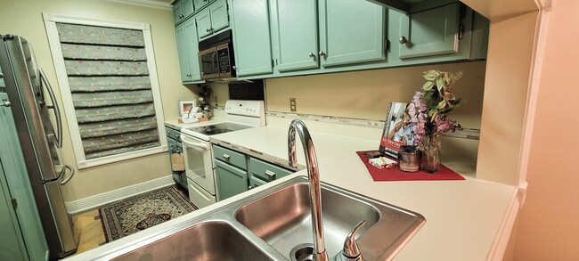 Snack/Breakfast Bar Area Looking Into Well-Appointed Kitchen - 416 Doucet Rd