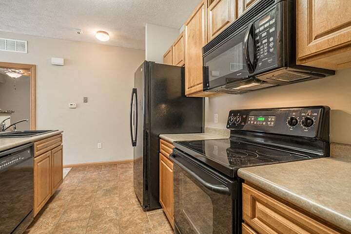 Sleek appliances and plenty of cabinet storage adorn our kitchens. - Stone Creek Villas