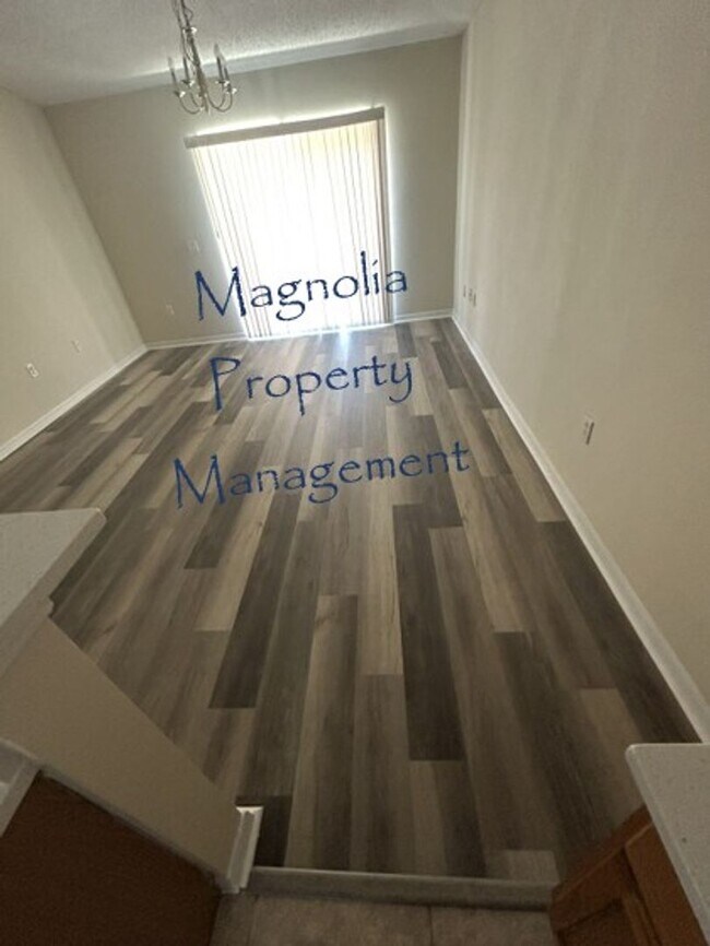 Building Photo - New Paint, Floors and Solid Surface Counte...