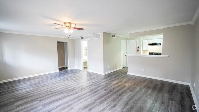 Spacious Living Room with Ceiling Fan - Windsor Manor