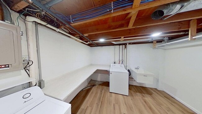 Building Photo - Updated two bedroom duplex, new stainless steel appliances, garage, and hardwood floors