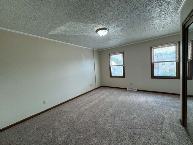 Building Photo - Love Grows — Spacious 2-Story Townhome