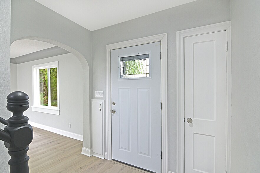 New storm door with easy glass opening for natural air flow. - 32584 River Vista Ln