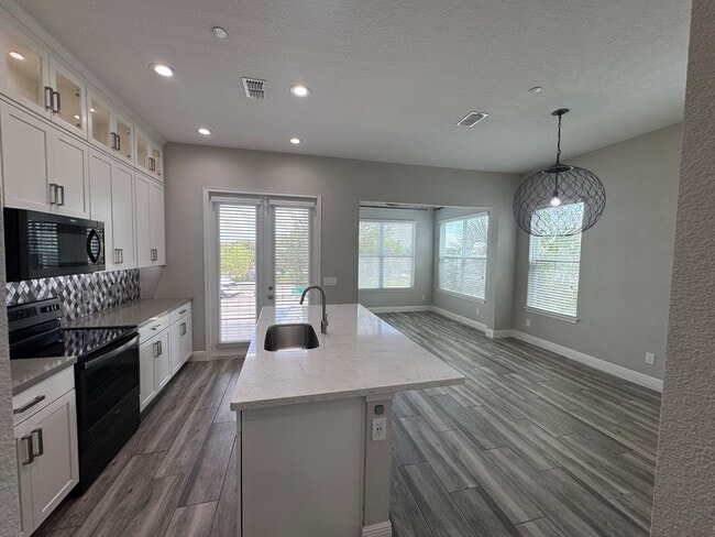 Building Photo - Lake Nona Move-In Special! Save $100/Month | 4 Bed, 3.5 Bath Laureate Park Townhome
