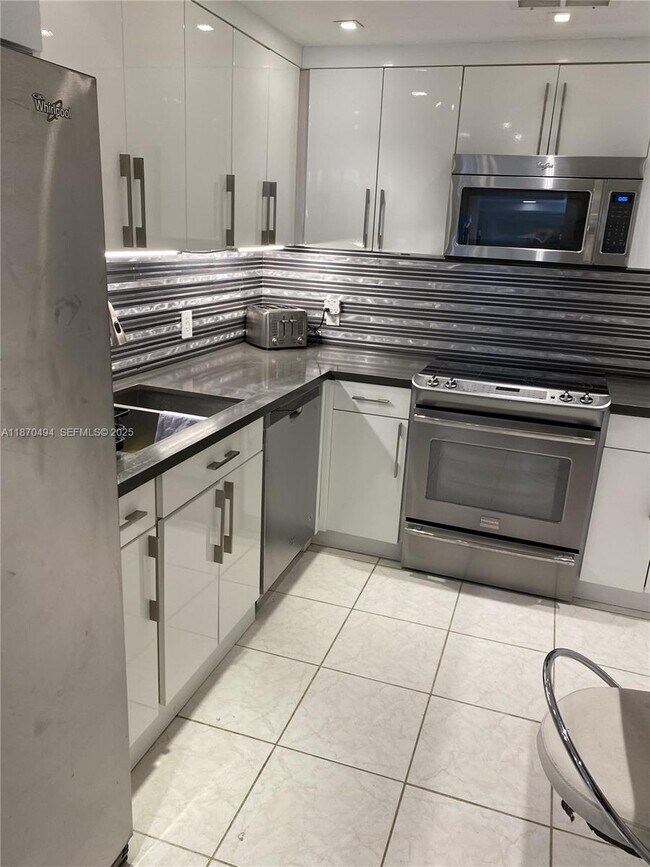 Building Photo - 10185 Collins Ave