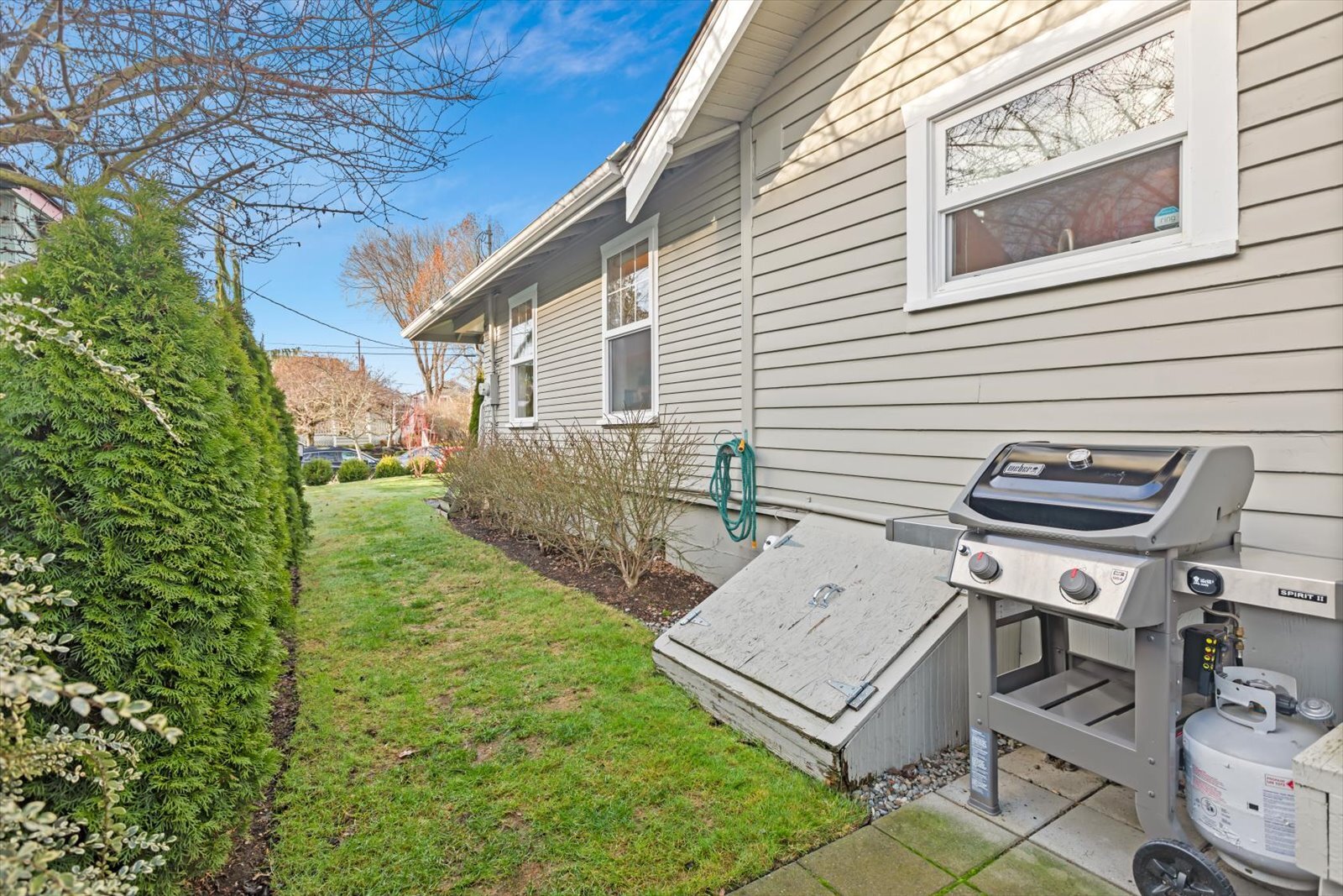 Side yard with weber grill for use - 8042 Earl Ave NW