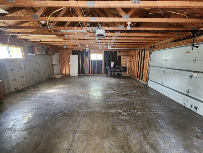 Building Photo - Nice home with oversized 2car gar with work bench and large shaded yard. Country-like setting