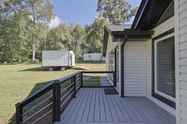 Building Photo - COMING SOON · Designer Renovation · Covered Deck Pavilion · 2-Car Garage · Lawn Care Included