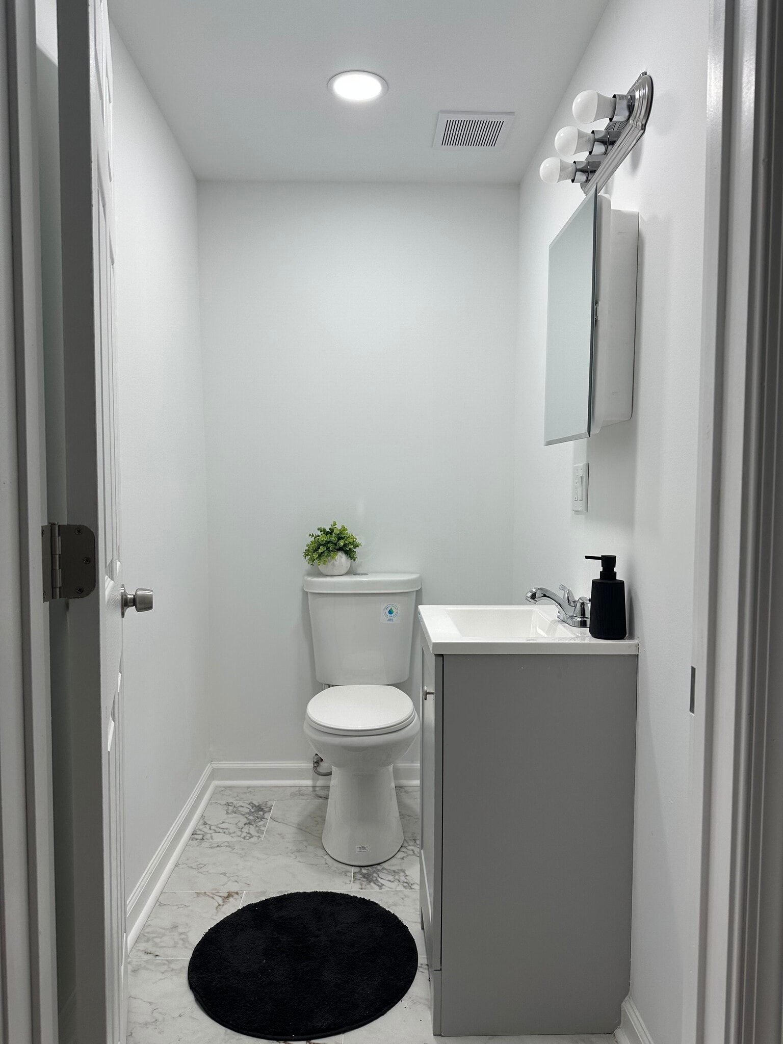 half bathroom conveniently located between the bedrooms - 313 N 37th St