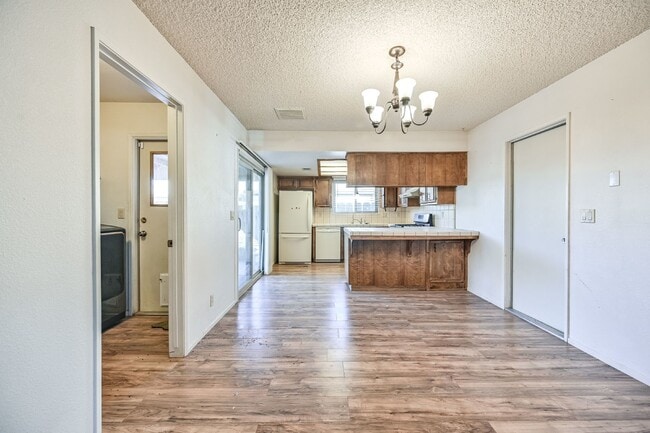 Building Photo - 3 bedroom, 2 bath with large living room and brick fireplace.  Good size kitchen with tons of cab...