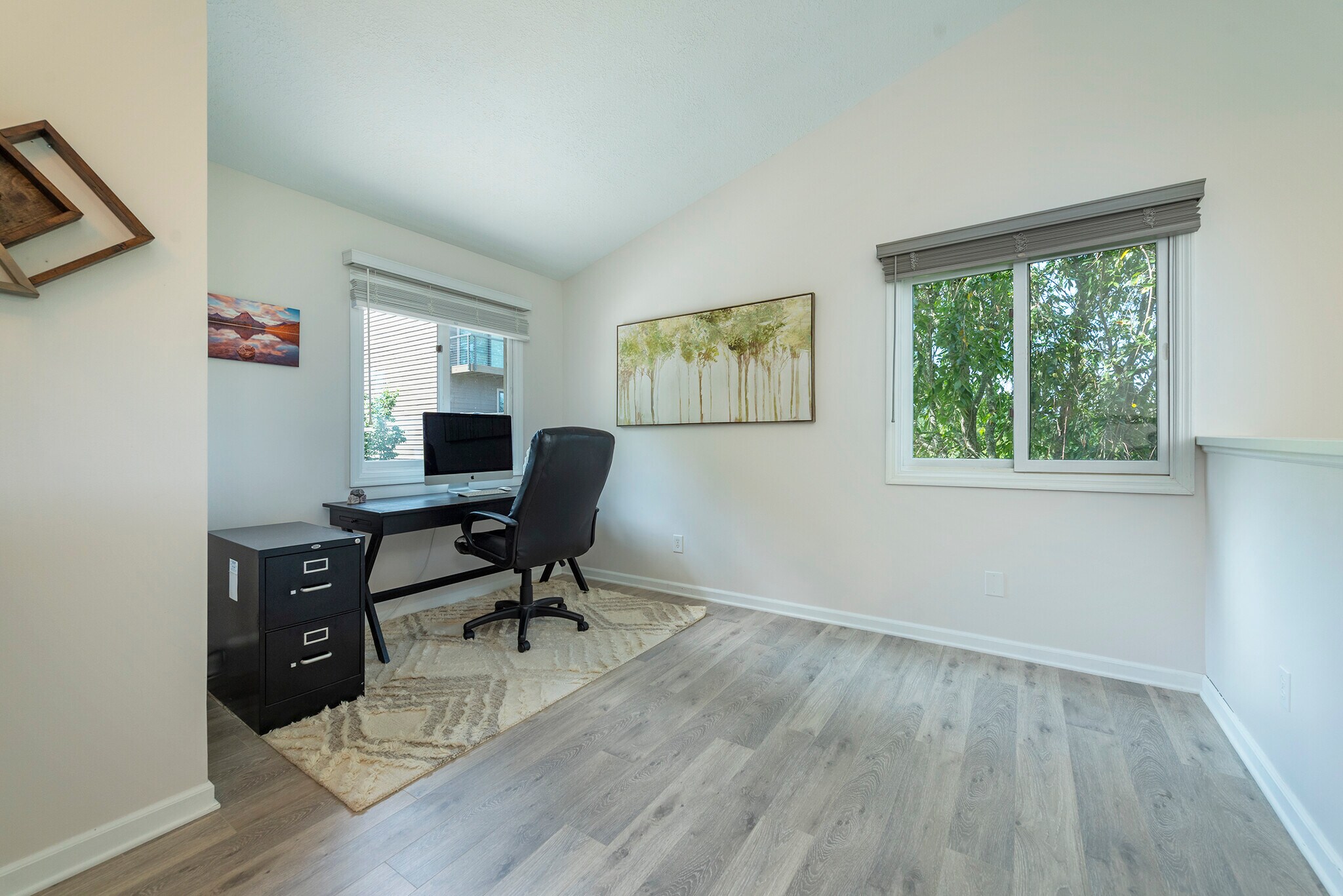 Multi-functional upstairs loft bathed in natural light, ideal for an executive home office. - 405 Windswept Dr