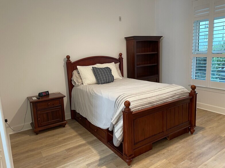 The bedroom and view of patio - 145 Pier View St