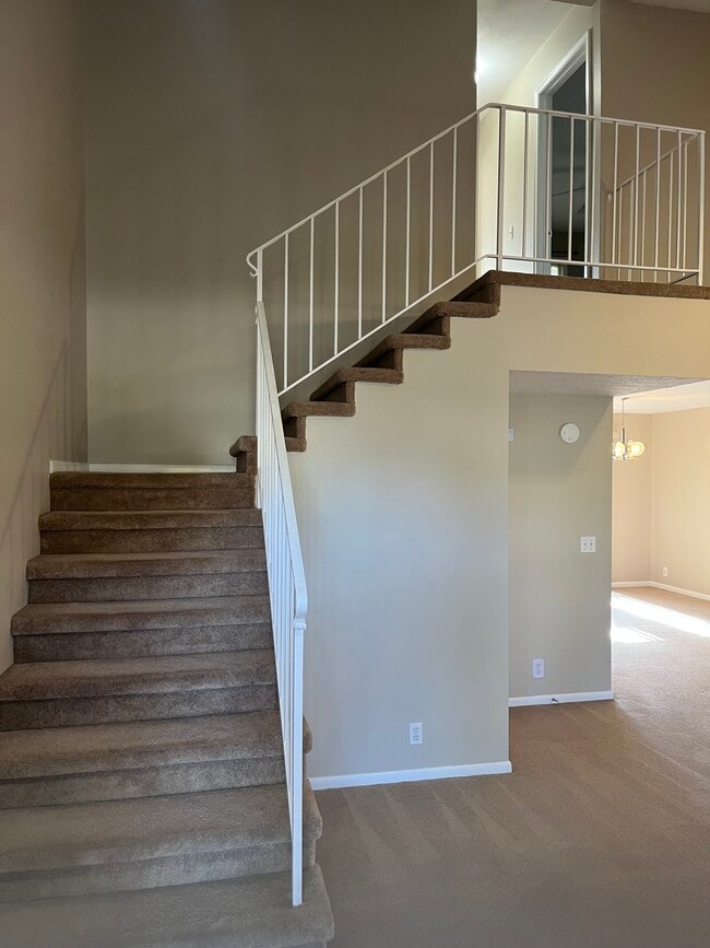 Beautiful stairwell with unique valted ceilings in living room - 12063 Burdette Cir