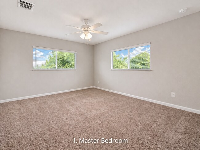 Building Photo - Spacious Three-Bedroom Home with Open Floor Plan, Large Yard & Screened Patio