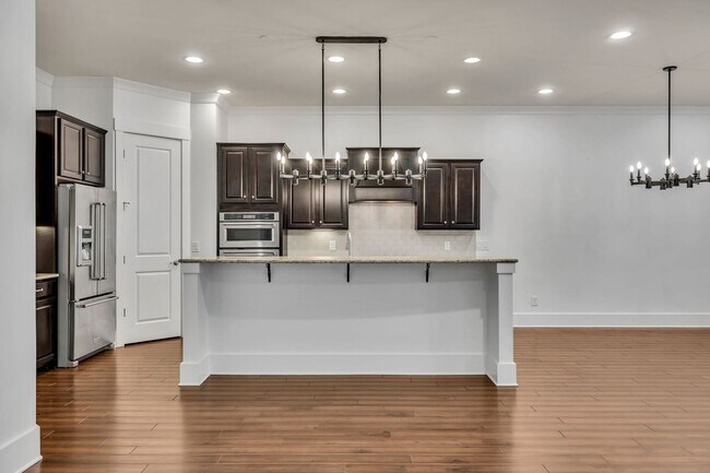 Building Photo - Beautifully maintained and move-in ready, this stunning mostly one-level all-brick home