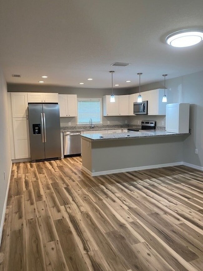 Building Photo - RENT BY THE ROOM - 1/2 or Whole Home!