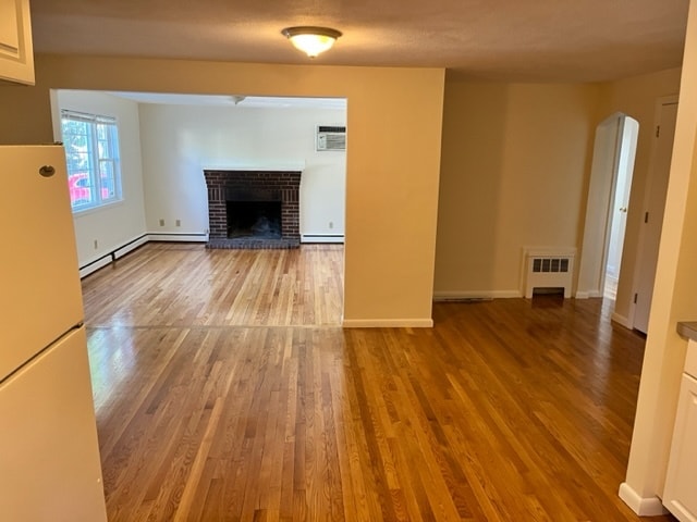 Bright living room with huge window. Fireplace is ornamental and cannot be used. - 18 Dunstan St