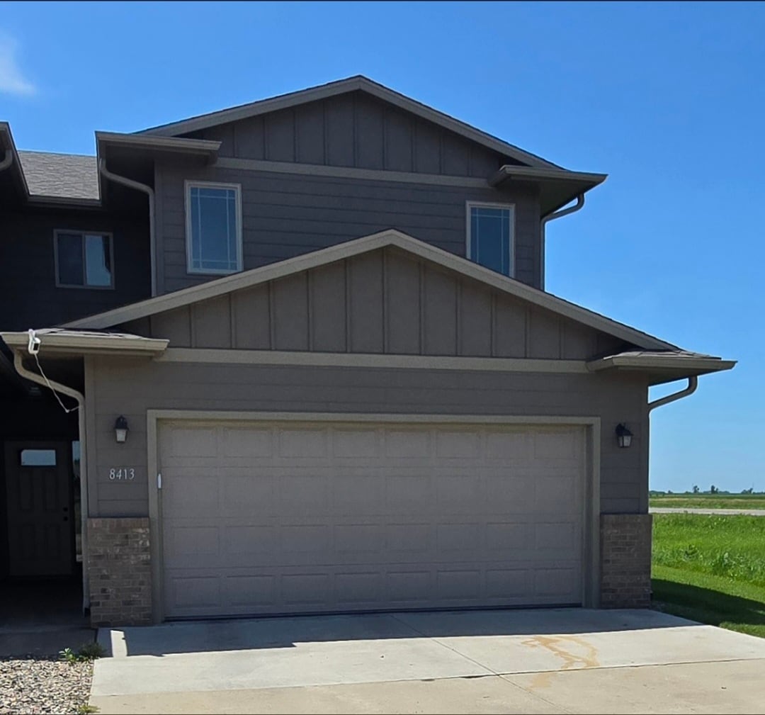 Three front facing windows, 2 Car Garage and covered Portico to Front Door. - 8413 W 53rd St