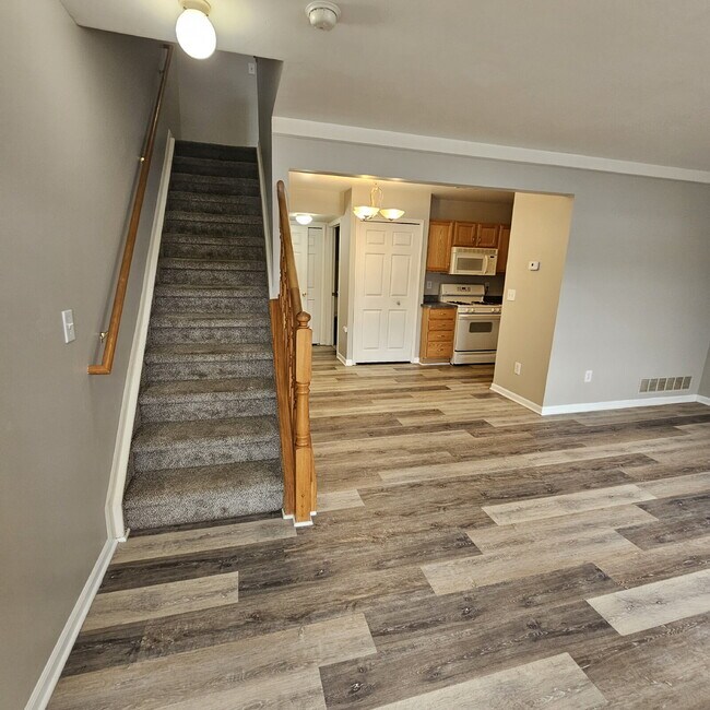 Building Photo - 2 Bedroom, 1.5 Bath Townhouse w/ Garage & Huge Master Bedroom. Full Sized Washer & Dryer In Unit.