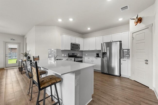 Building Photo - 13900 Mcarthur Dr
